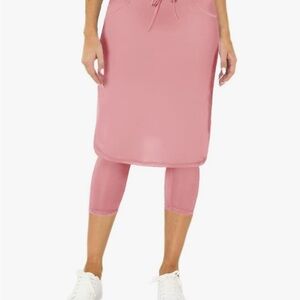 Pink women’s knee-length athletic skirt with leggings